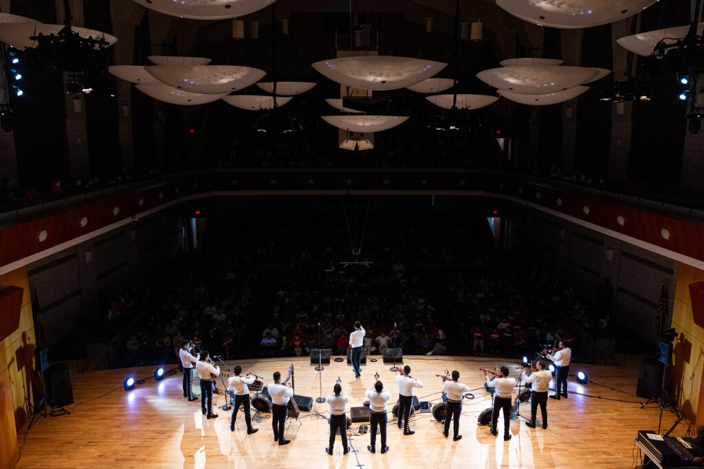 Local schoolchildren enjoy a mariachi performance