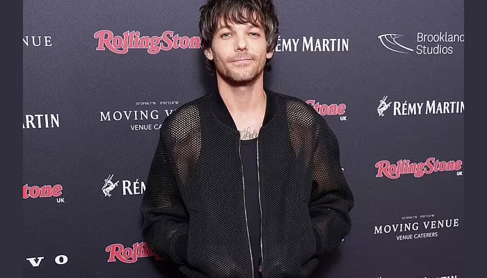 Louis Tomlinson Flashes Tattoos in Crochet Bomber Jacket at Rolling Stone Awards