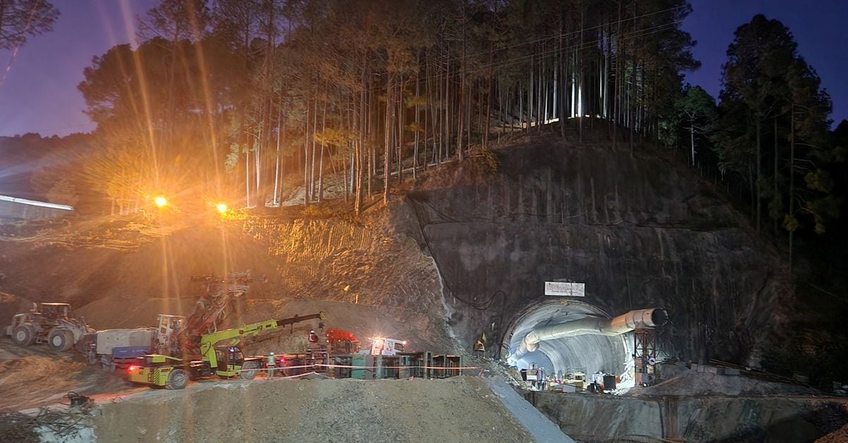 Rescuers drill to send more food to trapped workers in Indian tunnel