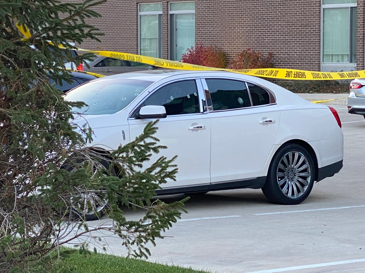 Car riddled with bullet holes after shots fired in parking lot of hotel on Fort Wayne’s north side