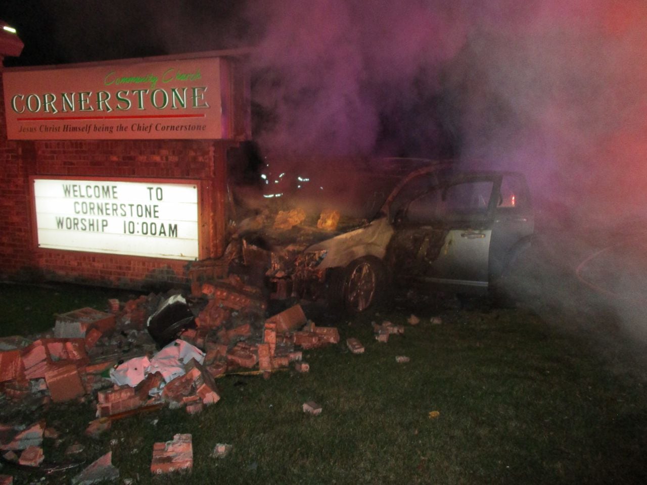 Car bursts into flames after driver falls asleep behind wheel, crashes into church sign