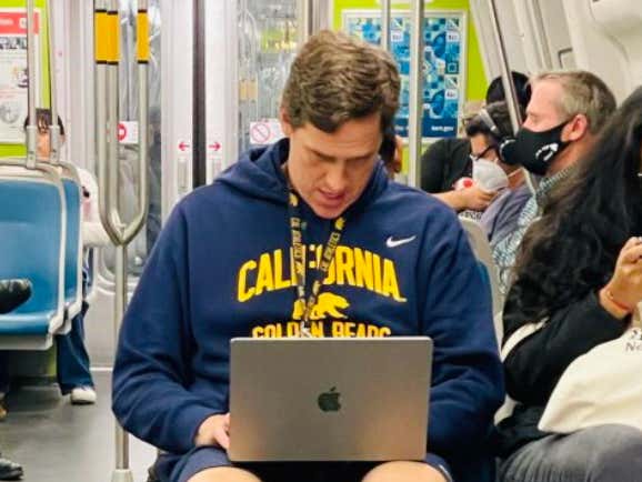 Respect The Grind … California Bears Basketball Coach Mark Madsen Watches Film On Public Transportation On The Way To Games