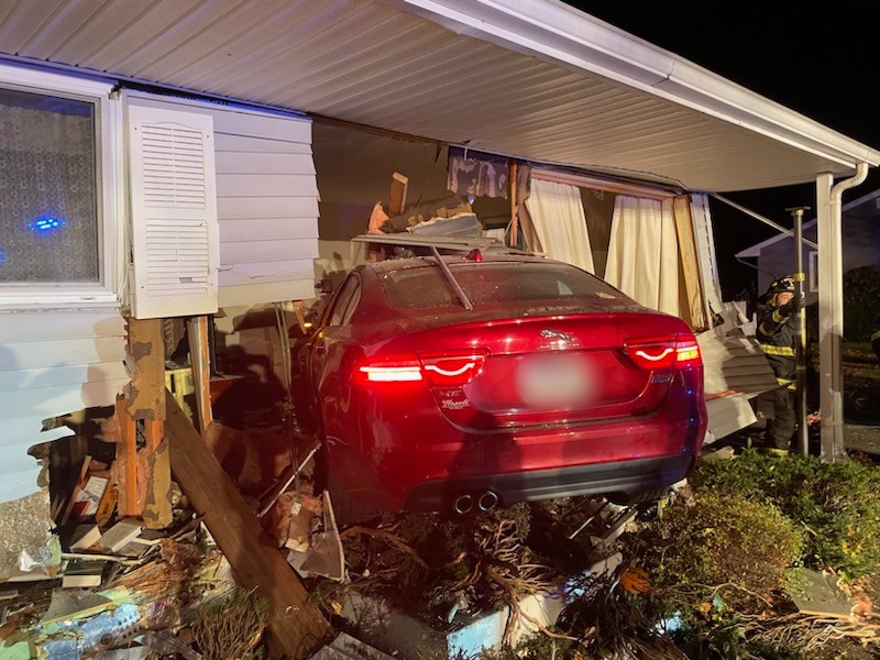 Car barrels into Swansea home