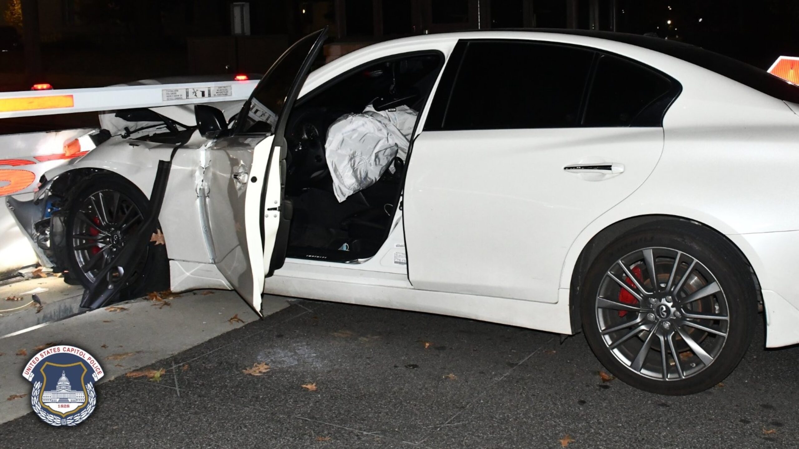 2 armed men arrested after crashing stolen car into barricade near Capitol