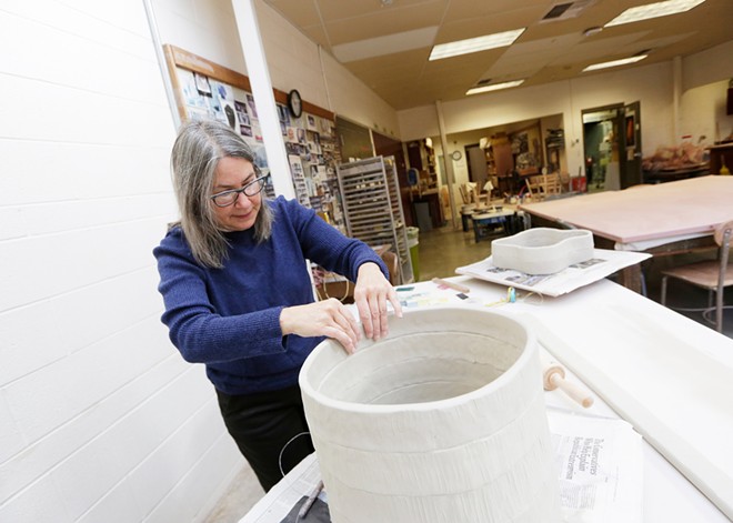 Before retiring from Eastern Washington University, ceramics instructor Lisa Nappa partakes in one last faculty art showcase