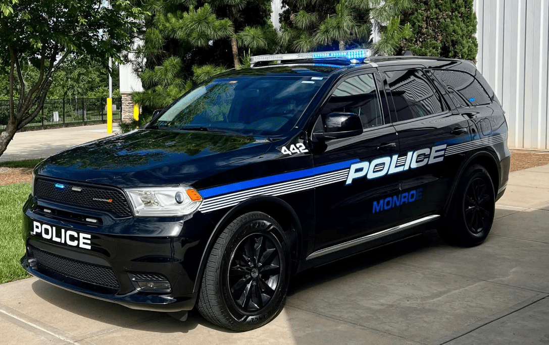 Woman charged with hitting 2 officers with her car