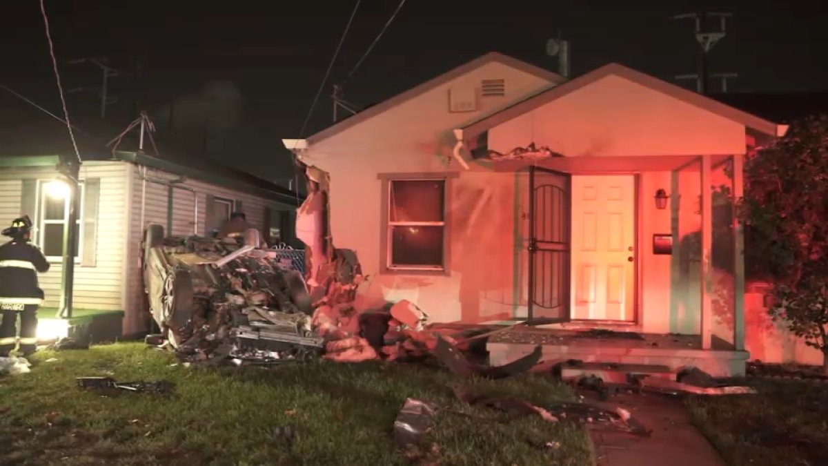 Woman hospitalized after speeding car slams into Oakland home