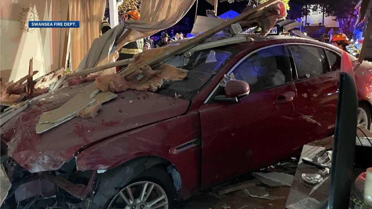 2 people taken to hospital after car crashes into New England home