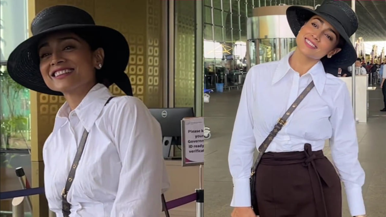 Shriya Saran stuns in a white shirt and pairs it up with a brown slit skirt as she papped at the Mumbai airport