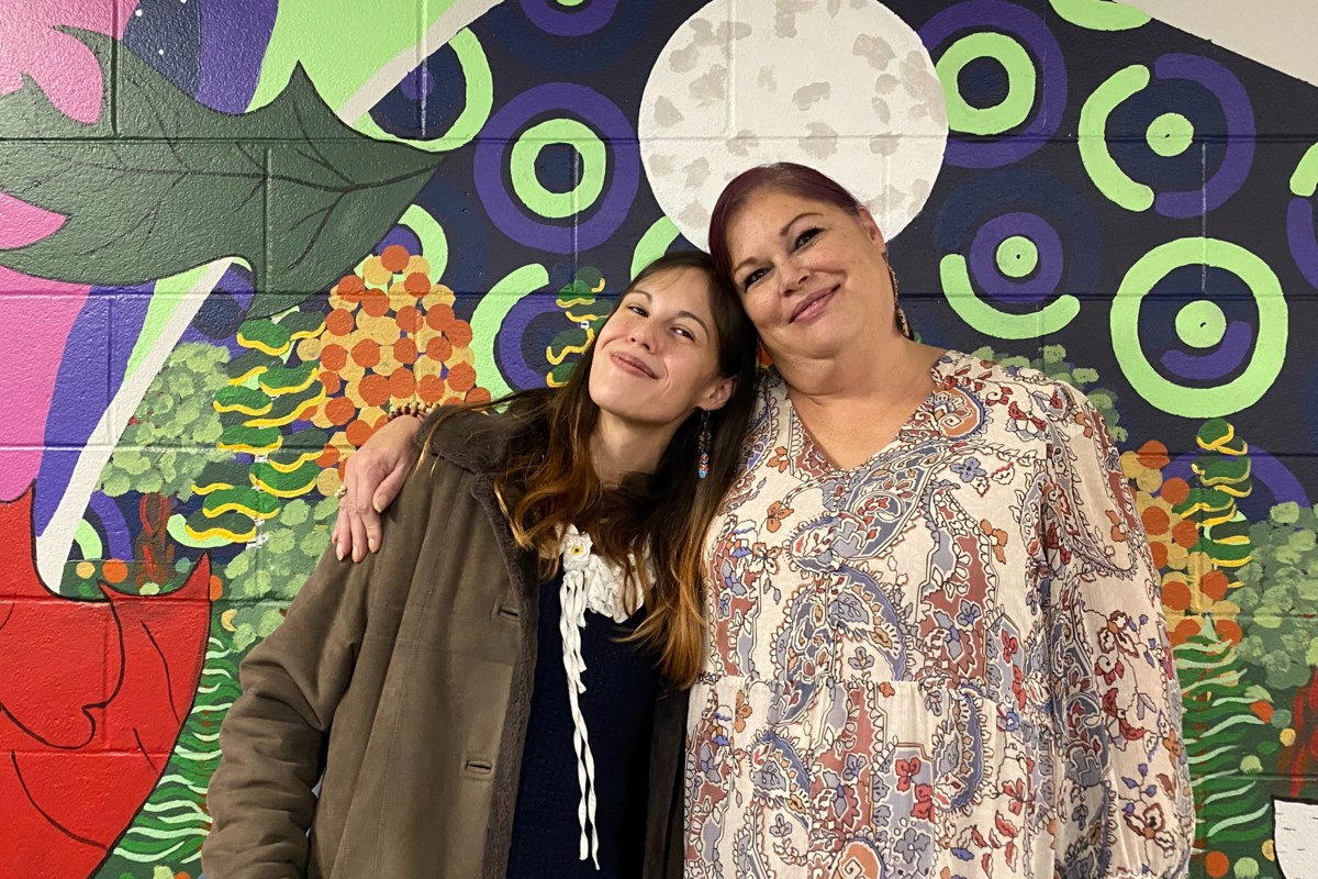 Mother and daughter sharing culture through art and learning