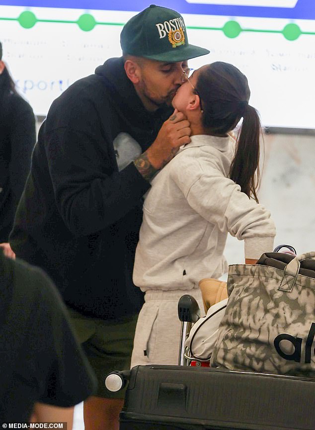 Nick Kyrgios kisses Costeen Hatzi as they return home to Australia