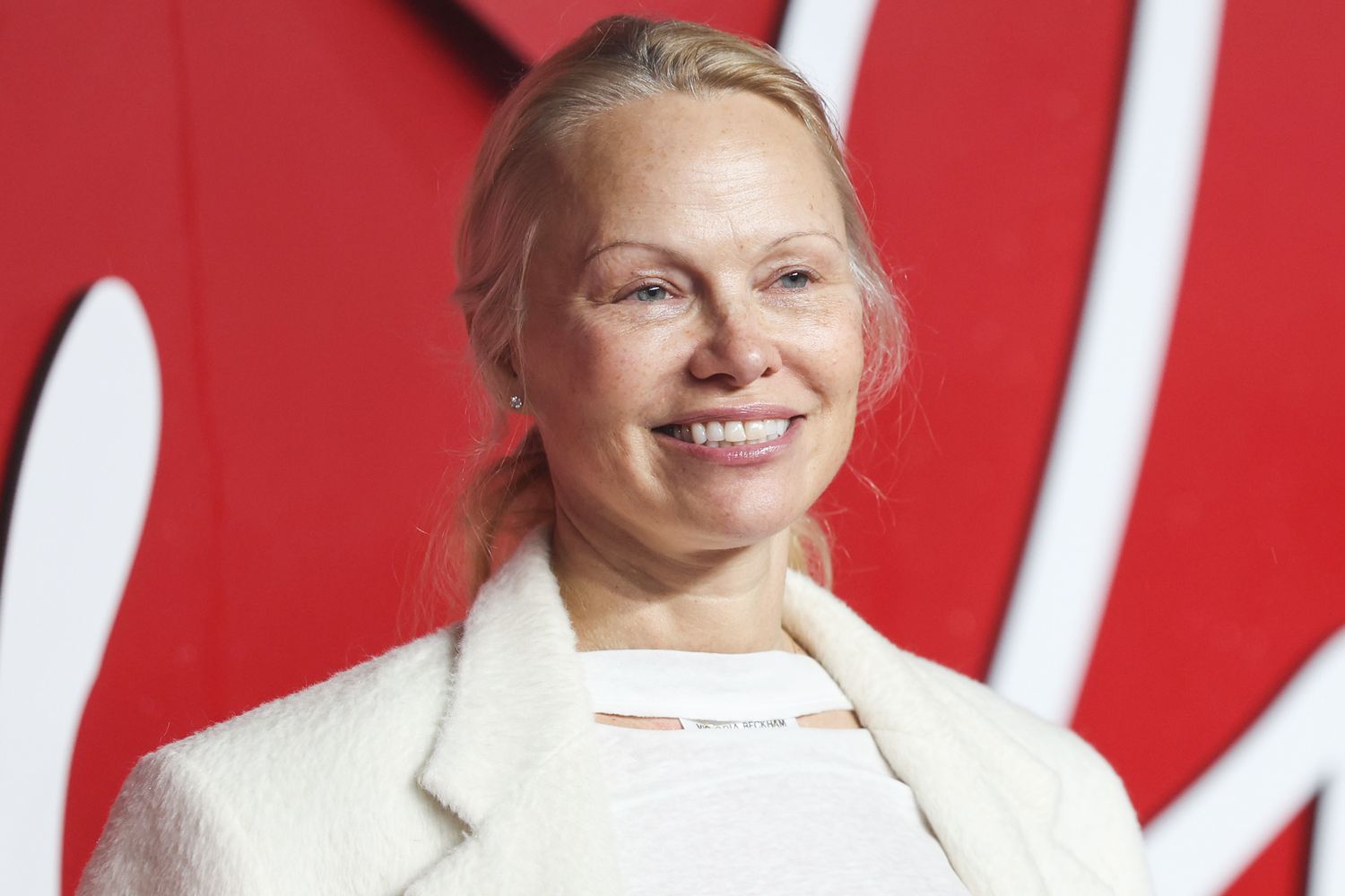 Pamela Anderson Makes Another Makeup-Free Appearance on 2023 Fashion Awards Red Carpet