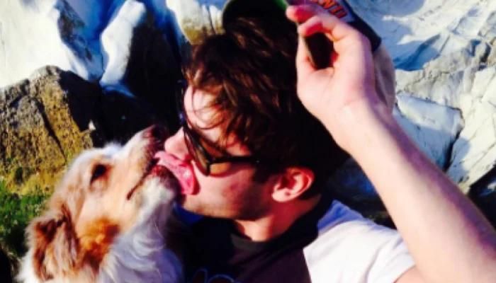 Shirtless Zac Efron Snuggles Up to a Huge Pet Dog