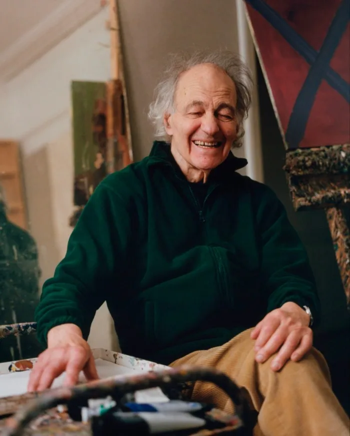 The painter sits in his studio