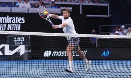 Cameron Norrie stretches for a backhand volley on the way to his third-round victory over Casper Ruud