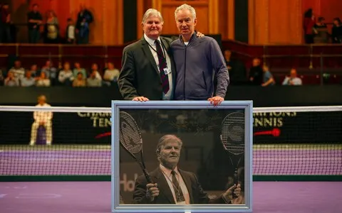 With McEnroe, right, after Mills announced his retirement from refereeing during the Masters Tennis at the Royal Albert Hall, London, December 2015  