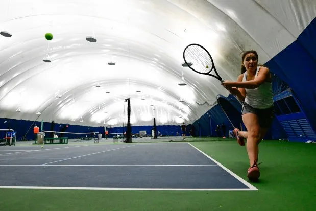 Sandra Redak keeps the ball in play at the Rocky Mountain Tennis Center in Boulder on Dec. 21. (Matthew Jonas/Staff Photographer)