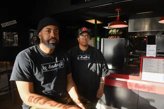 Owners of Le Bodega Eric Emedoh (left) and Terica Hills pose for a portrait inside the restaurant in North Augusta, S.C., on Thursday, Jan. 11, 2024.