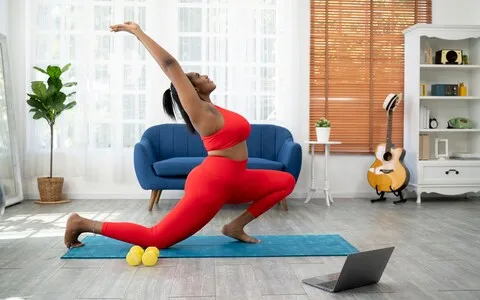 Woman does yoga at home