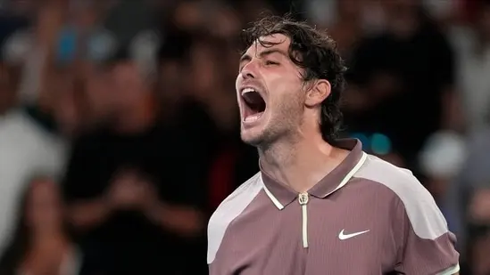 Taylor Fritz of the U.S. celebrates after defeating Stefanos Tsitsipas of Greece in their fourth round match at the Australian Open tennis championships at Melbourne Park, Melbourne, Australia, Sunday, Jan. 21(AP)