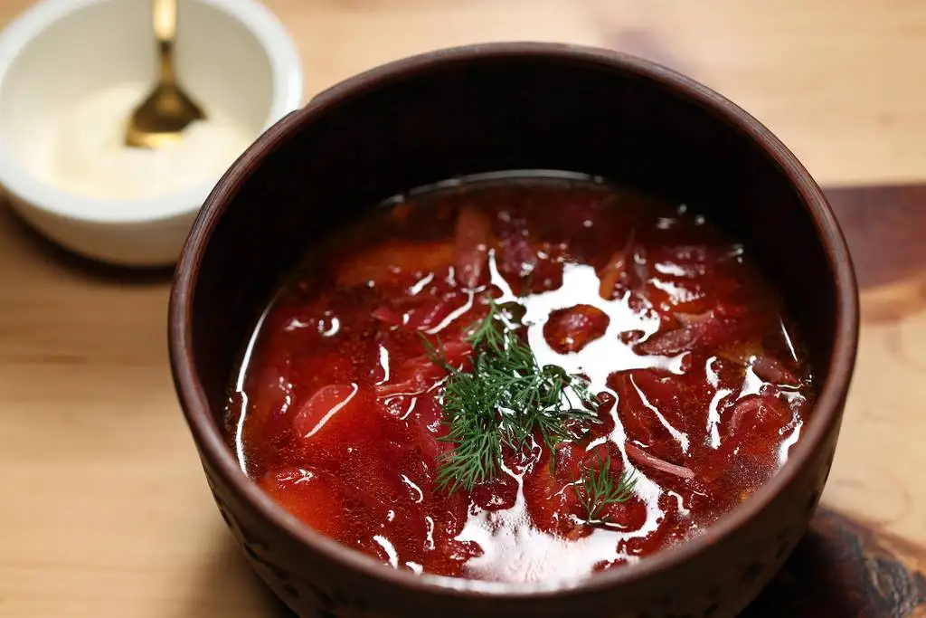 The borsch, made with tender shredded duck, cool cultured cream on the side and smoked pears.