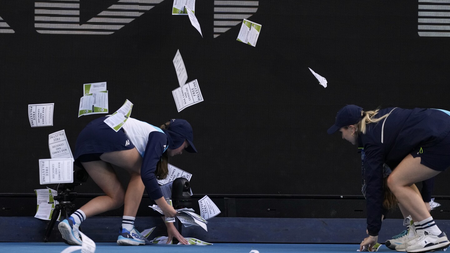 Protestor throws papers on court, briefly delaying Australian Open match between Zverev and Norrie