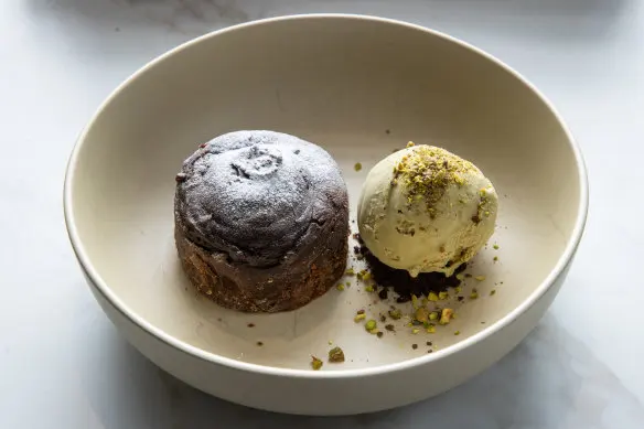 Bitter-sweet chocolate fondant with creamy pistachio gelato.