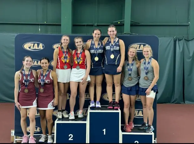 Lower Moreland's Rebecca Kideckel, left, and Hannah Kideckel stand at the top of the podium after winning the doubles PIAA-2A state championship. (Submitted photo)