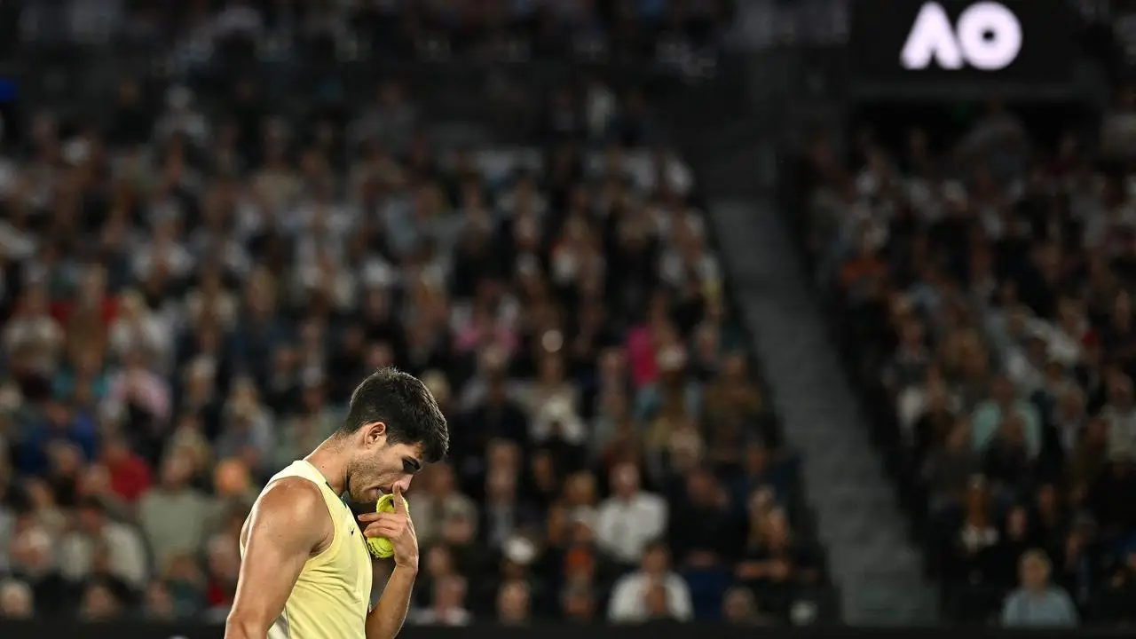 Spain's Carlos Alcaraz prepares to serve against Serbia's Miomir Kecmanovic during their men's singles match on day nine of the Australian Open tennis tournament in Melbourne on January 22, 2024. (Photo by Anthony WALLACE / AFP) / -- IMAGE RESTRICTED TO EDITORIAL USE - STRICTLY NO COMMERCIAL USE --