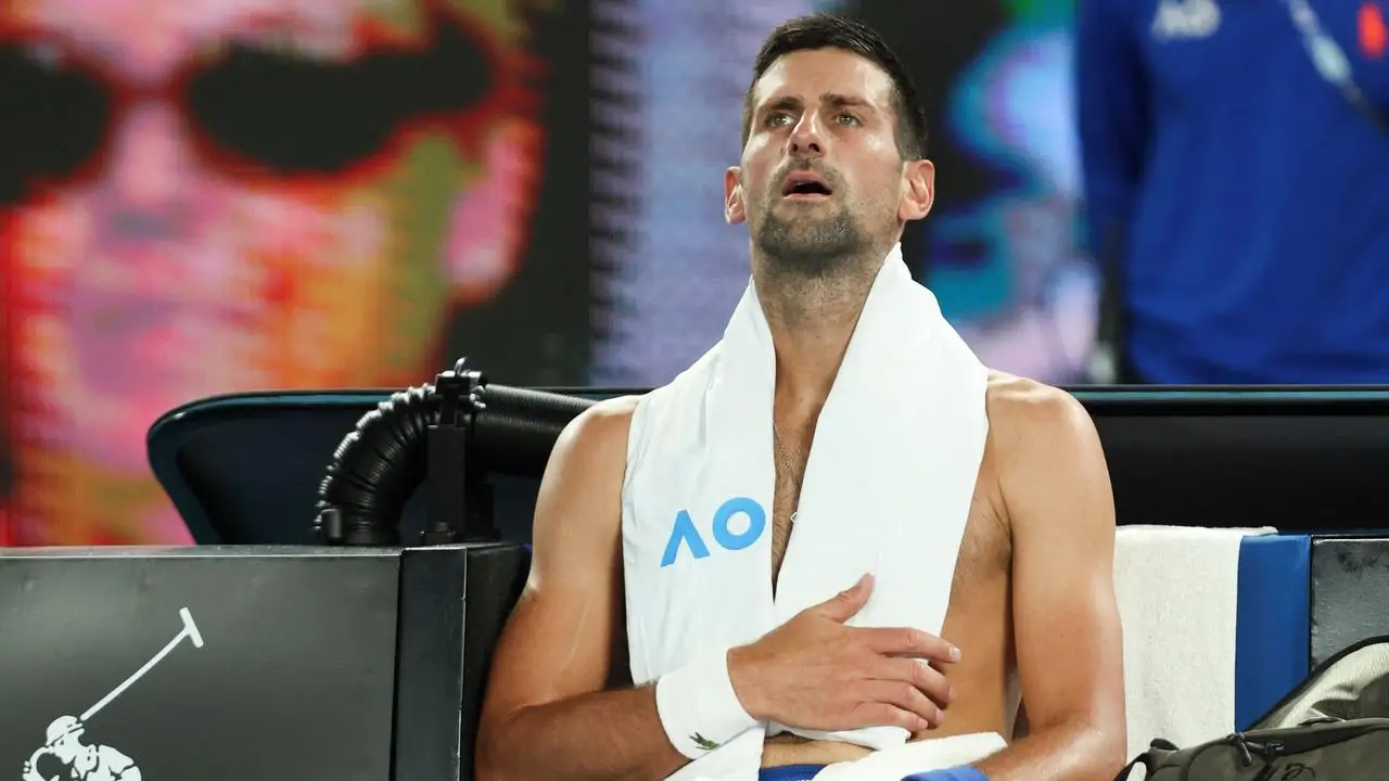 Djokovic tries to cool down during a match. (Photo by Martin KEEP / AFP)