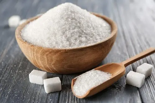 sugar in a bowl with spoon