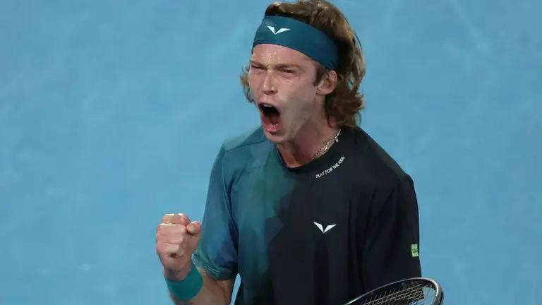 Andrey Rublev of Russia reacts after winning a point against Jannik Sinner of Italy during their quarterfinal match at the Australian Open tennis championships at Melbourne Park, Melbourne, Australia, Tuesday, Jan. 23, 2024. (AP Photo/Asanka Brendon Ratnayake)