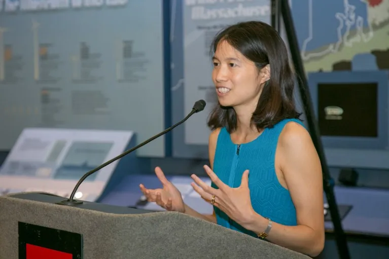 Melina Fan speaks at a podium