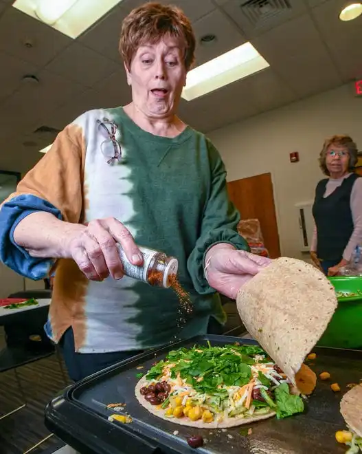 Carol Coddington and other participants make black bean and vegetable quesadillas during a Clemson SNAP-ED program Cooking Matters! class, teaching nutrition and recipes in a class at Belton Library Tuesday, January 23, 2024.