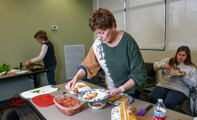 Carol Coddington and other participants make black bean and vegetable quesadillas during a Clemson SNAP-ED program Cooking Matters! class, teaching nutrition and recipes in a class at Belton Library Tuesday, January 23, 2024.