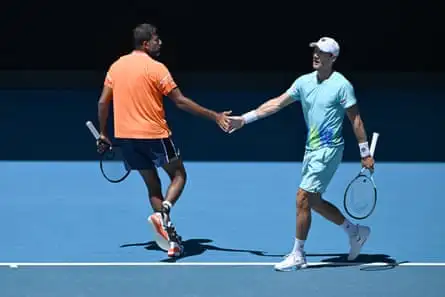 Rohan Bopanna and Matthew Ebden congratulate each other on court