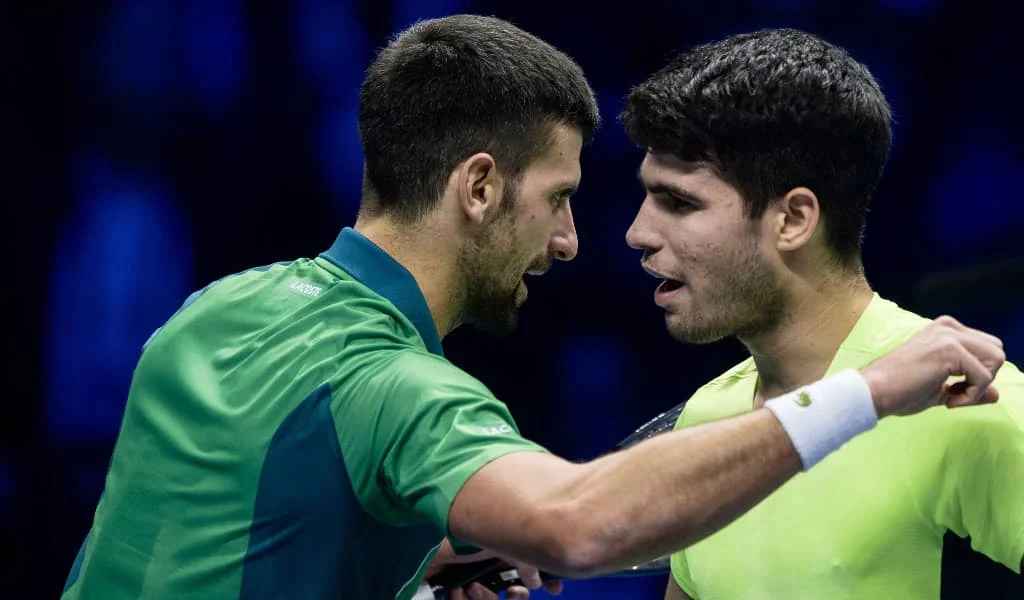 Novak Djokovic and Carlos Alcaraz at the net