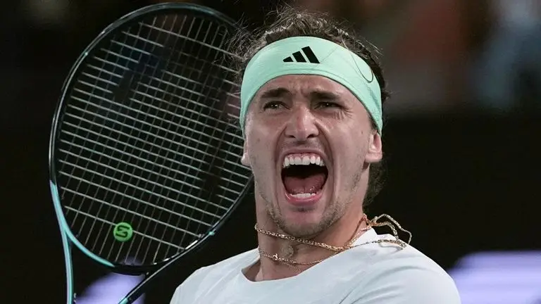 Alexander Zverev of Germany celebrates after defeating Carlos Alcaraz of Spain in their quarterfinal match at the Australian Open tennis championships at Melbourne Park, Melbourne, Australia, early Thursday, Jan. 25, 2024. (AP Photo/Andy Wong)