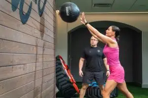 woman working out with personal trainer