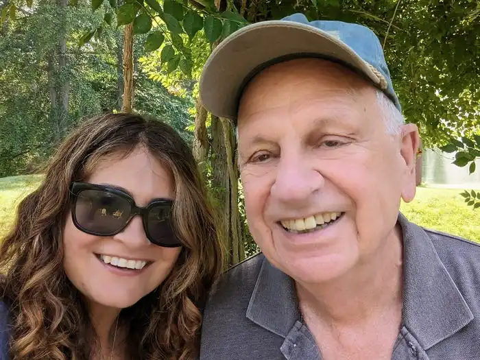 Dad and daughter posing for a photo