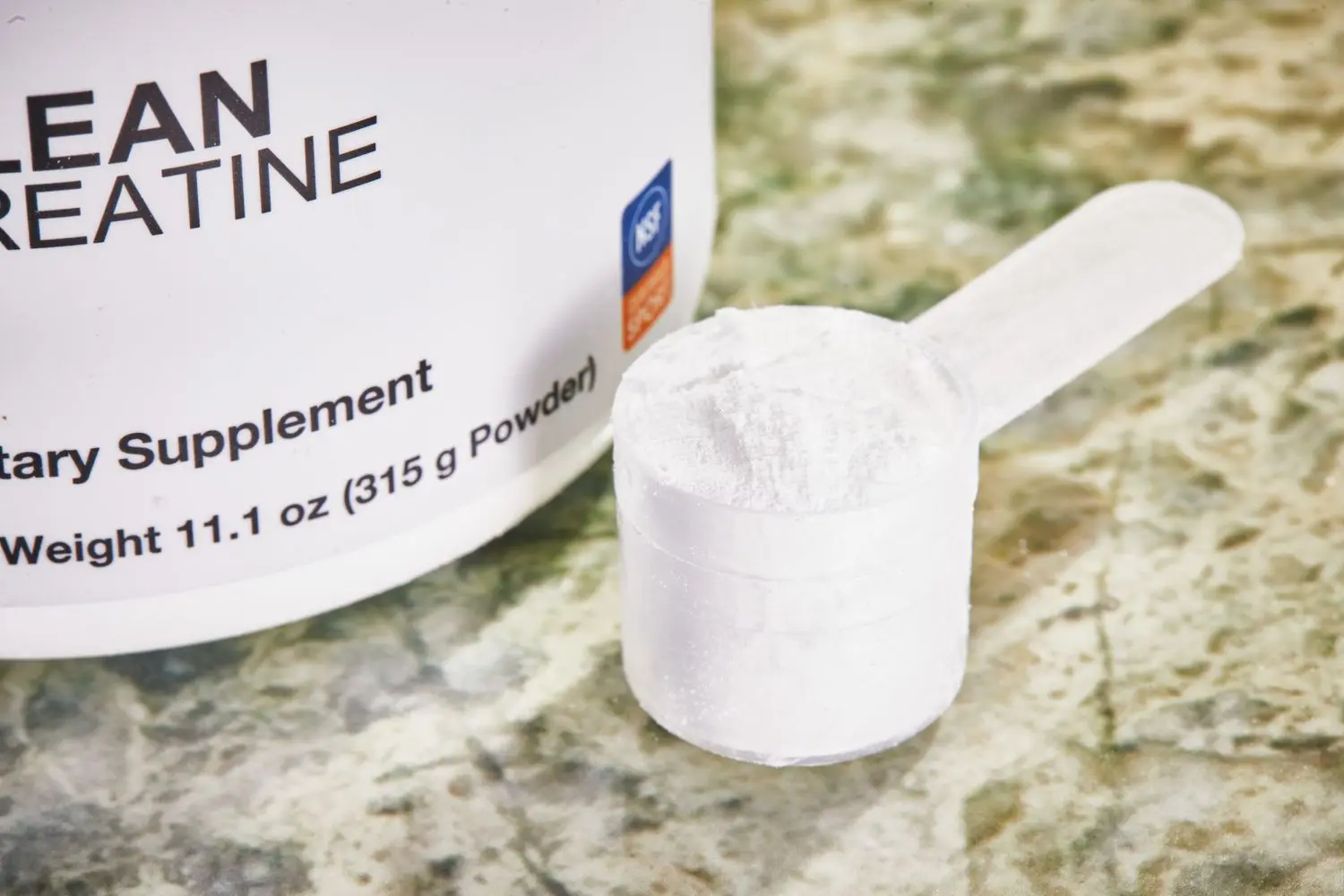 A scoop of Klean Athlete Klean Creatine