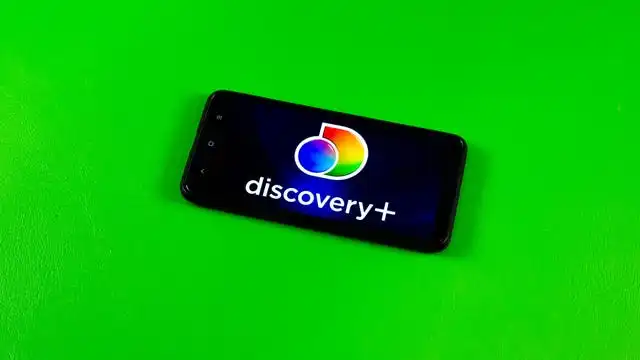 Discovery Plus logo on a phone