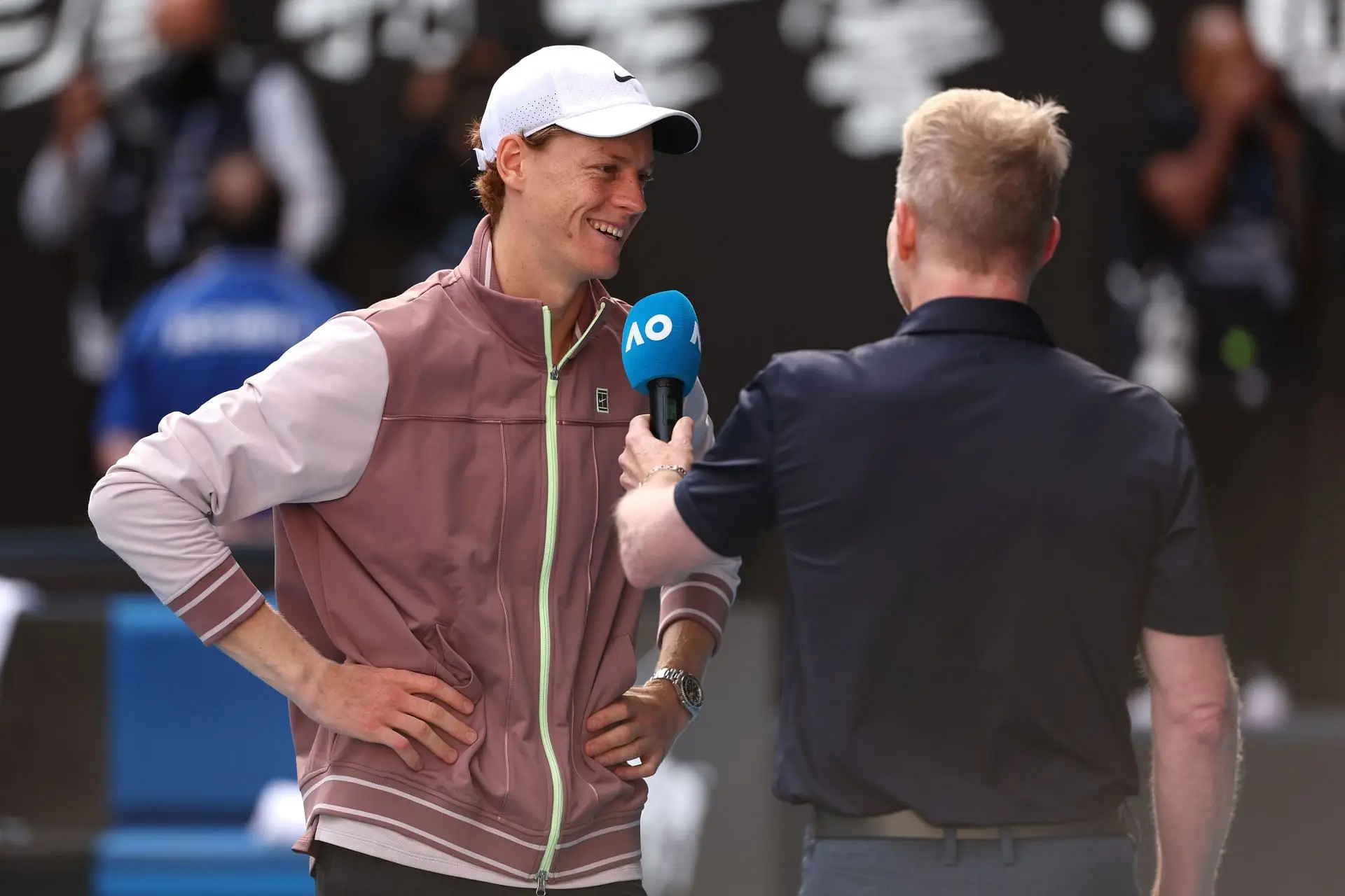 The Italian pictured with Jim Courier after her 2024 Australian Open semifinal win