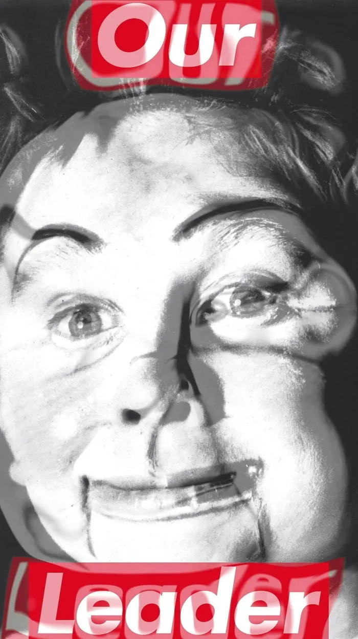 Video installation of face with slogan ‘Our Leader’