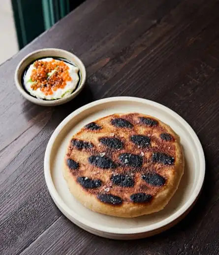 Grilled flatbread with horseradish cream and trout roe, at Sune, London E2.