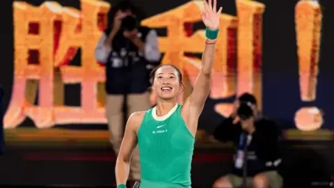 Getty Images Zheng Qinwen waves to the crowd after her semi-final victory on 25 January at the Australian Open