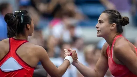 Getty Images Winner Aryna Sabalenka of Belarus is congratulated at the net by Qinwen Zheng of China after their Women's Singles Quarter-Finals match