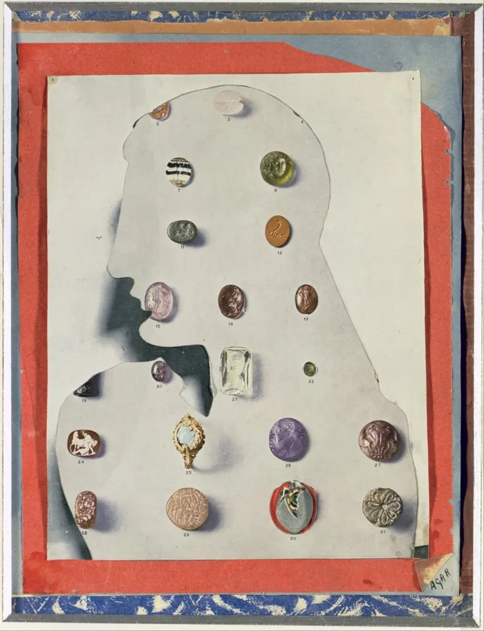 Mixed media with stones on a cut-out paper head
