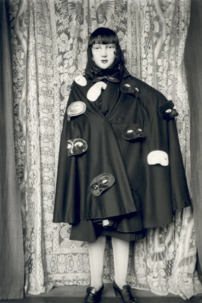 A woman in a black cape