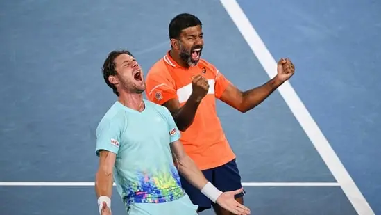 India's Rohan Bopanna (R) and Australia's Matthew Ebden celebrate after victory against Italy's Simone Bolelli and Andrea Vavassori during their men's doubles final match on day 14 of the Australian Open tennis tournament(AFP)